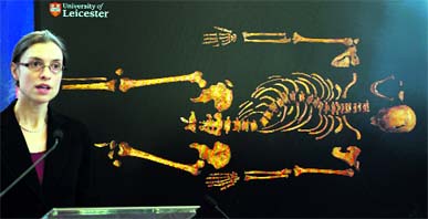 Bioarchaeology lecturer Dr Jo Appleby addresses the media in front of an image of the skeleton of Britains 15th century King Richard III, at Leicester University on Monday. The skeleton was found under a car park in Leicester. King Richard III is widely regarded as one of history's most notorious villains.