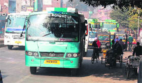 A bus parked on the road slows down traffic flow.