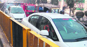 Vehicles move at a snails pace on Saheed Baba Deep Singh Road.
