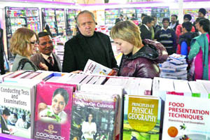 Visitors search for the books of their choice at the World Book Fair-2013 at Pragati Maidan in New Delhi on Tuesday. 
