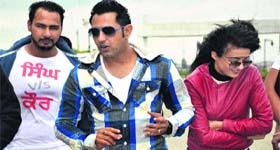Singer and actor Gippy Garewal with actor Surveen during the promotion of Punjabi movie Singh vs Kaur in Jalandhar on Tuesday