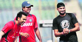 Rohit Sharma, Pragyan Ojha and Harbhajan Singh during a practice session in Mumbai on Tuesday.