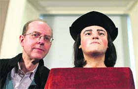 Royal recall: Michael Ibsen, (L) a descendant of Englands King Richard-III, with a plastic facial model made from the recently discovered skull of the king, at a press conference in London, on Tuesday