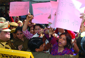 Women activists up in arms against the Naked and the Nude painting exhibition at Hauz Khas Village in New Delhi on Wednesday.