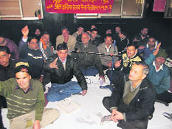 Railway employees hold a protest dharna in support of their demands at the Dehradun railway station on Wednesday.