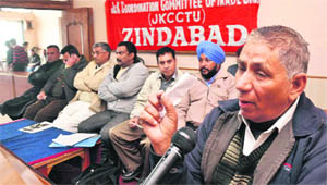 Speaker delivers lecture during the convention of employees and workers in Jammu on Wednesday. 