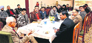 Governor NN Vohra with DRDO scientists at Raj Bhawan in Jammu on Tuesday.