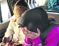 Two women, who were arrested for immoral trafficking in Gopal Nagar, being taken to a police station in Jalandhar on Wednesday