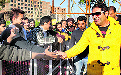 Singer KS Makhan shake hands with fans on a visit to Lovely Professional University for the promotion of his upcoming Punjabi film Sajjan in Phagwara, near Jalandhar, on Wednesday