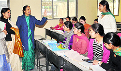 Students of KMV participate in a mobile quiz on the college campus in Jalandhar on Wednesday