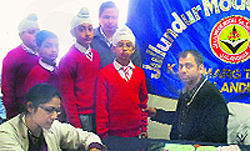 Doctors examine students of Jullundur Model School during a medical camp in Jalandhar