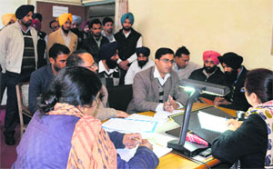 Employees of 108 Ambulance Workers Union meet Assistant Labour Commissioner Mona Puri in Ludhiana on Wednesday.