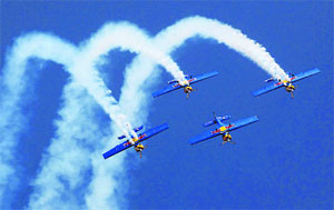 Red Bulls Zlin 50LX aircraft perform at Aero India show in Bangalore on Wednesday.