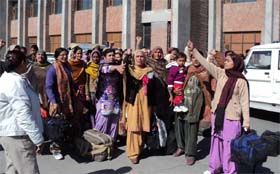 Women raise slogans after their release from jail in Faridkot on Wednesday