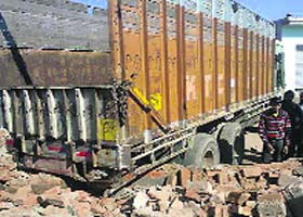 The truck that rammed into the wall of a dharamshala housing an anganwari at Mansas Ahlupur village on Wednesday