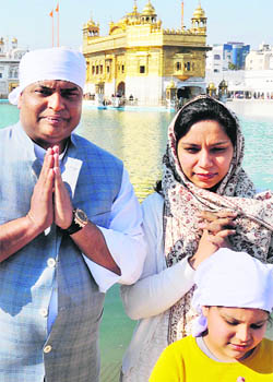 President Pranab Mukherjees son Indrajit Mukherjee and his wife Sugandhi pay obeisance at the Golden Temple in Amritsar on Thursday. 