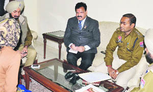 Rajkumar Verka, Vice-Chairman, SC/ST Commission (centre), listens to the grievances of a rape bid victim in Amritsar on Thursday.   