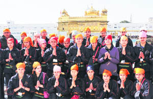 Girl students from Kishtwar in Jammu and Kashmir pay obeisance at the Golden Temple, Amritsar, on Thursday.