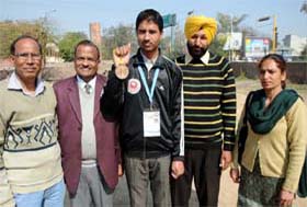 Bathinda lad Jaspreet Singh (centre), shows the bronze medal that he won in taekwondo at an international meet held in Thailand in January this year