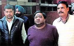 Accused Rahul (centre) being taken to a court in Mohali on Thursday