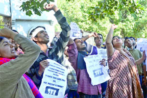 Activists of the Students Federation of India shout slogans against Delhi Police for resorting to lathicharge during the Gujarat Chief Minister Narendra Modis visit to Delhi University,  in New Delhi on Thursday. 