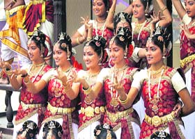Artistes perform during the ongoing 27th Surajkund International Mela at the picturesque mela complex in Surajkund