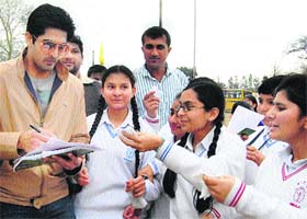 Boxer Vijender Singh gives autographs to students in Ambala