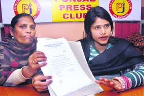 Neha Arora with her mother-in-law addresses media in Jalandhar on Thursday