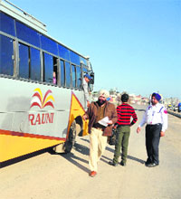 Police personnel check a bus with tinted glasses in Ludhiana on Thursday. 