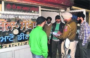 The police records statements of shopkeepers at Hari Singh Grewal Market near Tajpur Road in Ludhiana on Thursday.