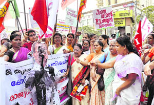 Women activists stage a protest against Rajya Sabha Deputy Chairman PJ Kurien at Kochi on Thursday. 