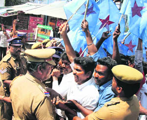 The police detains Tamil activists ahead of Sri Lankan President Mahinda Rajapaksa's visit to India in Coimbatore on Thursday. 