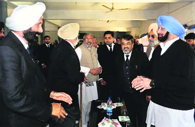 Punjab Congress president Capt Amarinder Singh and party candidate Vijay Sathi interact with lawyers in Moga on Thursday. 