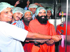 A file photo of Swami Ramdev inaugurating a food park unit in Haridwar. 