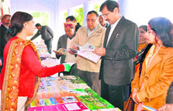 Chief Development Officer BS Dhanik with Education Department officials at the inauguration of a book fair as part of the Literate India Campaign at Panna Lal Bhalla College in Haridwar on Friday. 