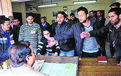 SFI activists gherao the Controller of Examination to protest against the prospectus price hike at the HPU in Shimla on Friday