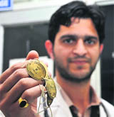 A doctor shows a token introduced at SMGS Hospital in Jammu. 