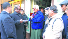 Jammu and Kashmir Chief Postmaster General John Samuel interacts with people in Srinagar on Friday.