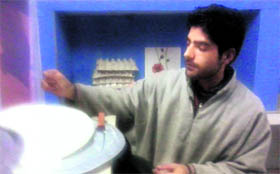 Muzzafar Ahmad Gojri sells cheese at Chogal village.