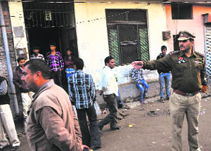 The police outside the victims house in Ludhiana on Friday.