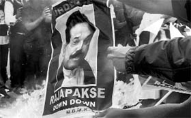 MDMK activists burn posters of Sri Lankan President Mahinda Rajapaksa in New Delhi on Friday.