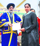 Punjab Education Minister Sikander Maluka presents the degree to a student. 