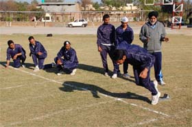 Coach Rajinder Singh Saini giving tips to the students at Malwa College