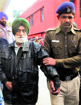 Terrorist Santokh Singh Bajwa in police custody in Chandigarh on Saturday.