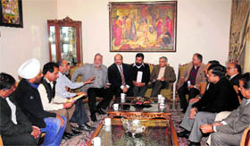 Industrialists and traders discuss various issues with Railway Minister and local MP Pawan Kumar Bansal at his residence in Chandigarh on Saturday.