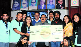 Navsankalp volunteers donate money for the treatment of a four-month-old child suffering from community acquired pneumonia at DAV College, Sector 10, in Chandigarh on Saturday.