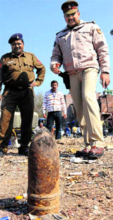 The police personnel inspect an artillery shell found at Ramdarbar on Saturday.