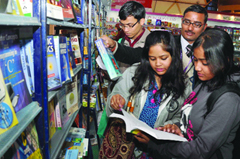 Visitors during the ongoing World Book Fair 2013 at Pragati Maidan in New Delhi on Saturday.