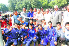 Students of Gurukul Mahavidyalya being presented awards by Chancellor of Uttarakhand Sanskrit University Mahaveer Aggarwal in Haridwar on Saturday.