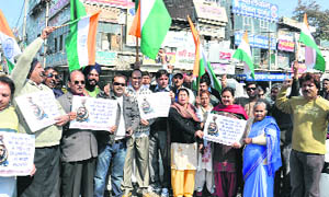 Activists of an NGO celebrate the hanging of Afzal Guru, a convict in the attacking of Parliament in 2001, in Karnal on Saturday.